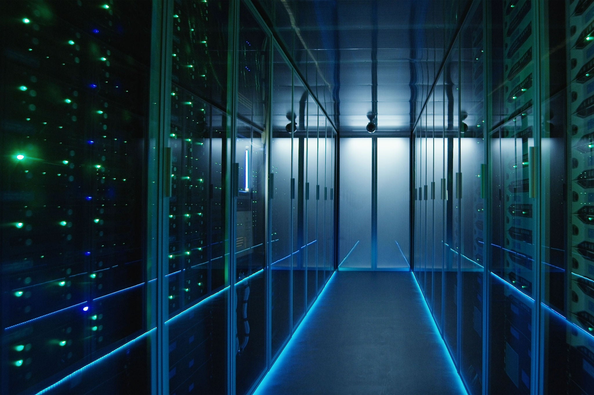 Long hallway full server racks in a modern data center