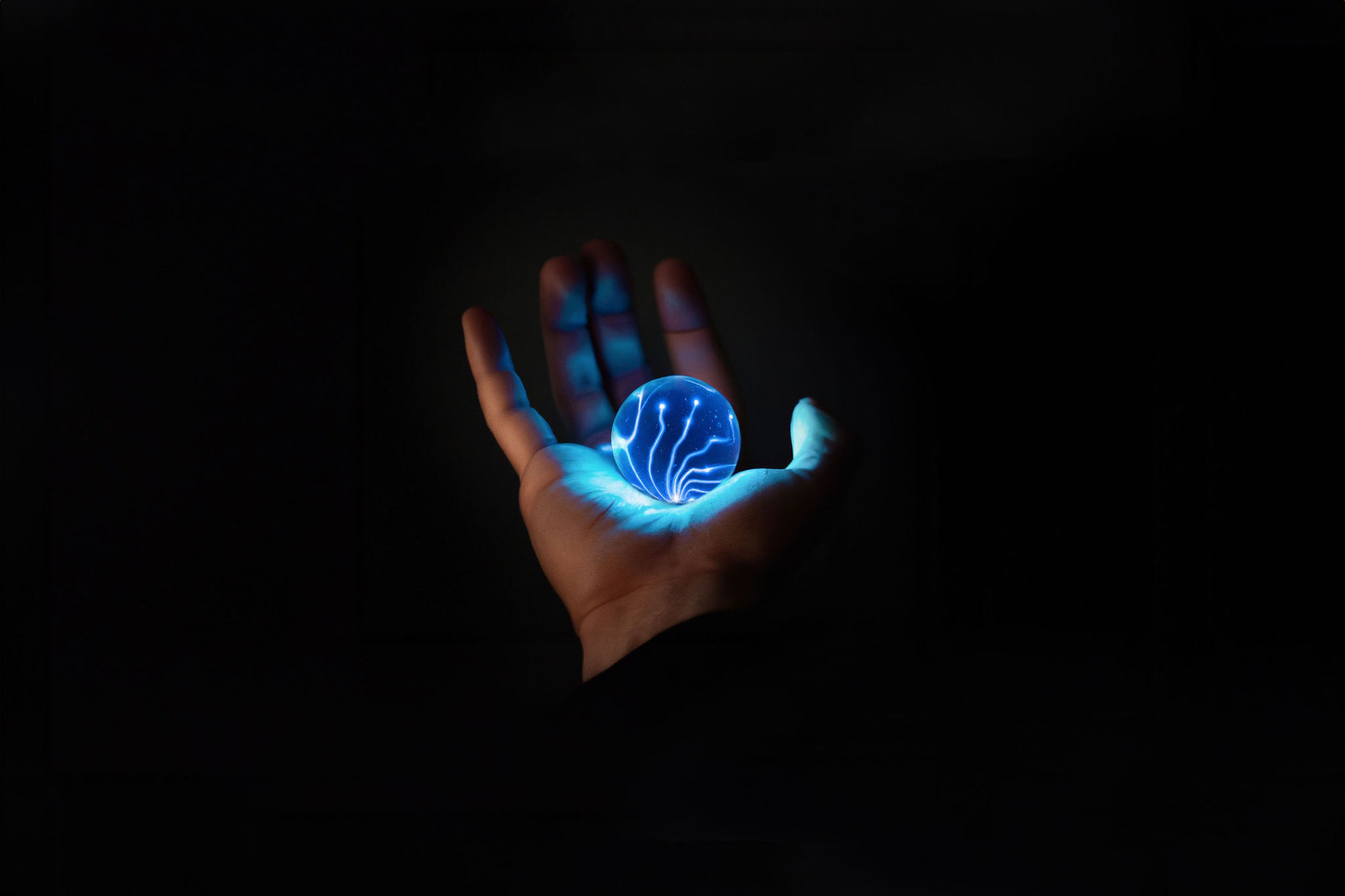 Hand holding electric orb